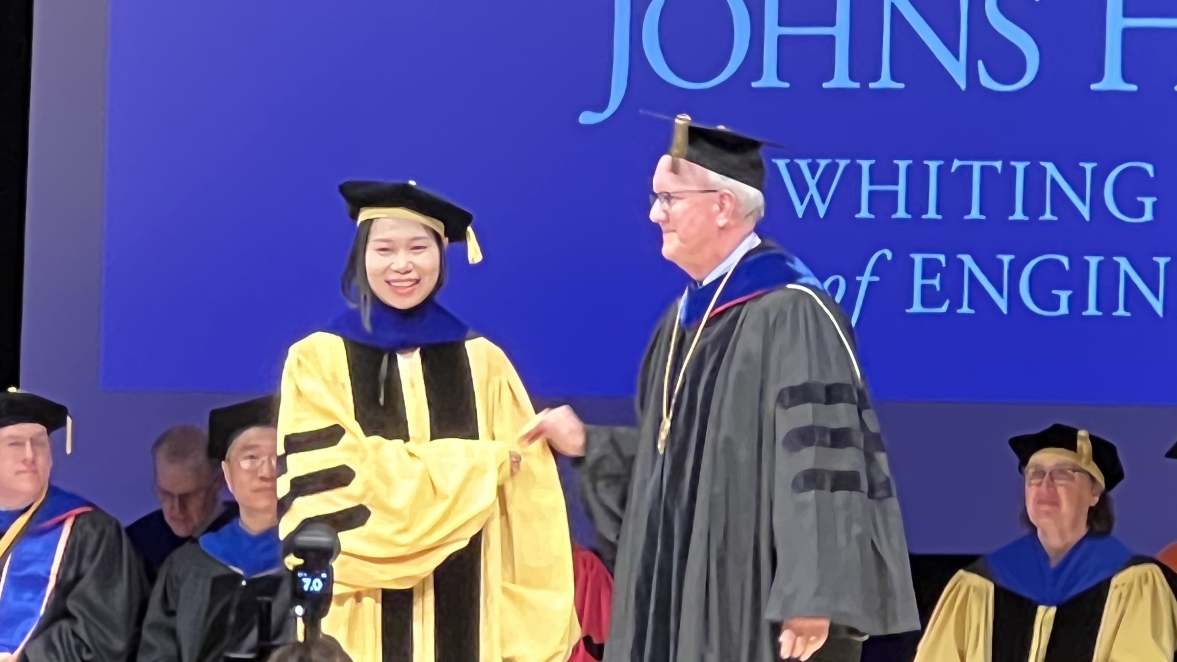 Dr. Muhan Shao being hooded by Prof. Jerry L. Prince.