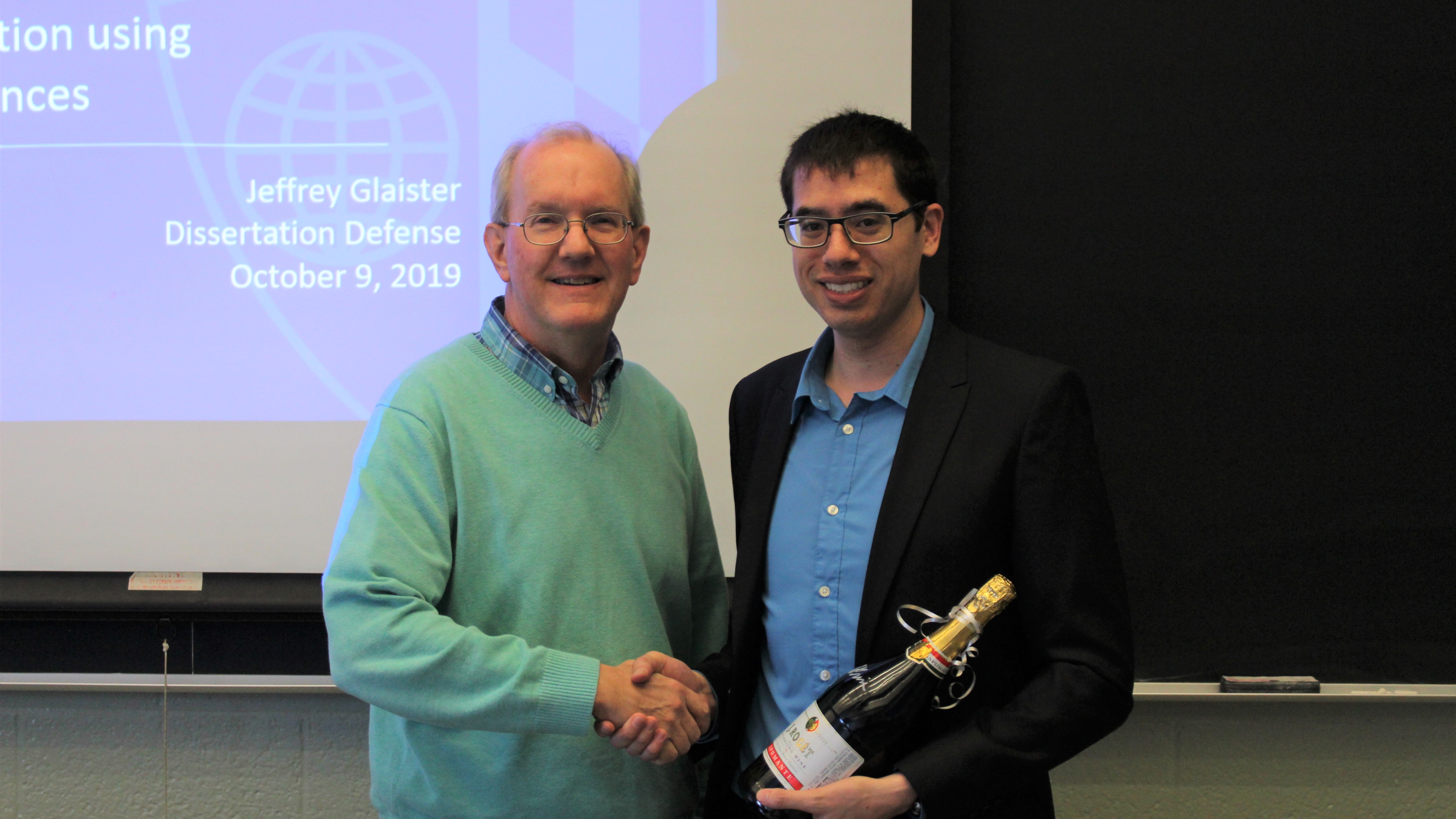 Prof. Jerry L. Prince congratulating Jeffrey Glaister on his successful defense in October 2019.